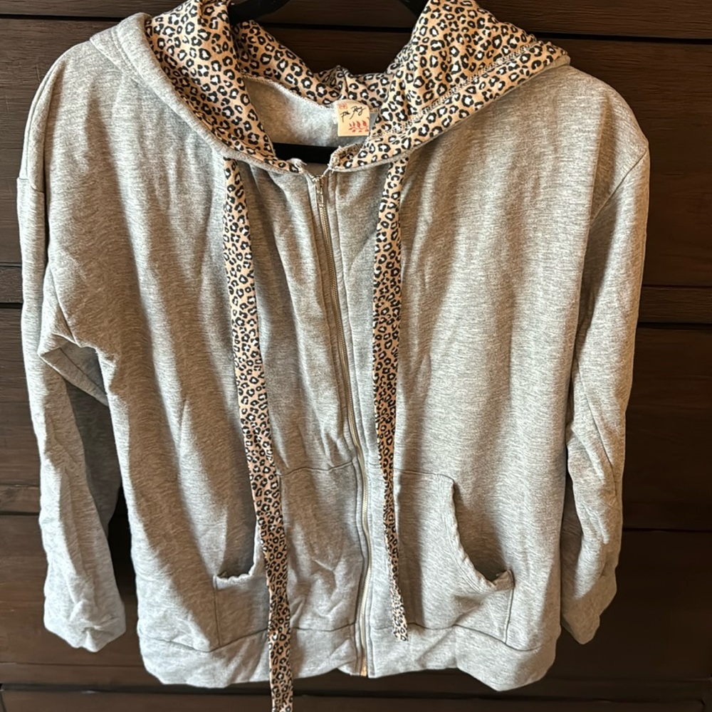 Light grey full zip hoodie with leopard lined hood